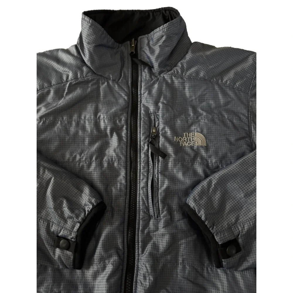 The North Face Mens Medium Blue Plaid Jacket With Built In Stow Away Bag Pocket